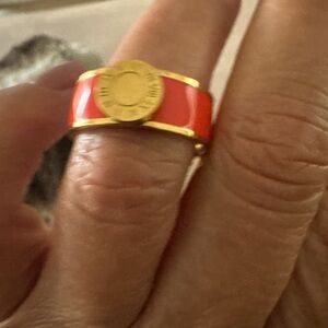 Brings orange and gold ring